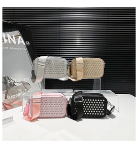 Multiple crossbody camera bags with stud details and wide straps in gold and silver