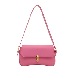 Pink leather baguette shoulder bag with gold metal clasp on a clean white background