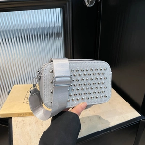 Chic silver square crossbody bag with sparkling rhinestones and industrial metal studs