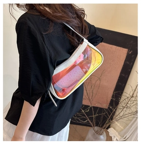 Back view of model wearing a holographic laser shoulder bag with white leather trim