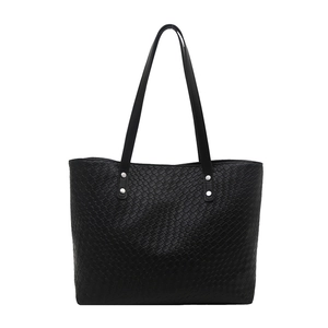 Classic black woven leather tote bag with long handles and silver rivet details