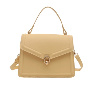 Minimalist yellow PU leather tote bag with a golden ring buckle and top handle
