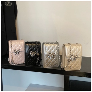 Quilted crossbody phone bags with bow buckles in pink, black, silver and gold finishes