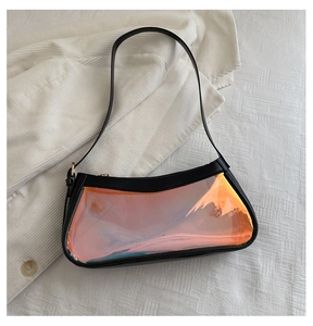 Flat lay of laser rainbow transparent tote bag with black leather frame and shoulder strap