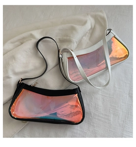 Close-up of iridescent laser panels on black and white leather baguette shoulder bags