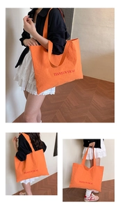 Detailed views of the large orange canvas tote bag with contrast lettering print