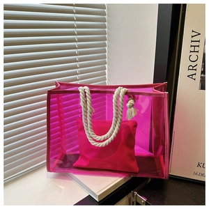 Pink transparent PVC tote bag with thick cotton rope handles and fabric inner pouch