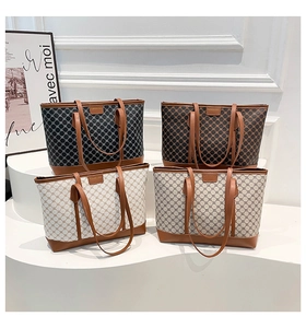 Detail showing high-capacity tote bags in classic vintage patterned coated canvas