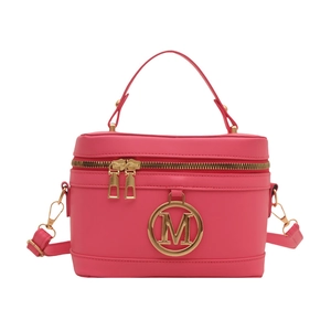 Minimalist pink box-style handbag with gold M-logo hardware and adjustable shoulder strap
