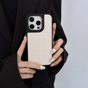 Close-up of woven fabric texture and camera metal ring on iPhone protective case