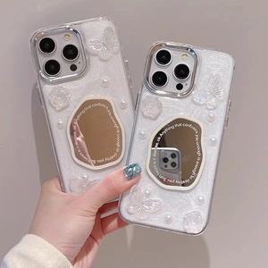 Detail of glitter phone case with 3D roses, pearls, and a mirror for iPhone 16 Pro