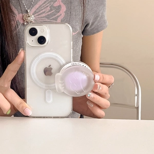 Detail of magnetic MagSafe phone grip with purple fish-shaped expandable airbag stand