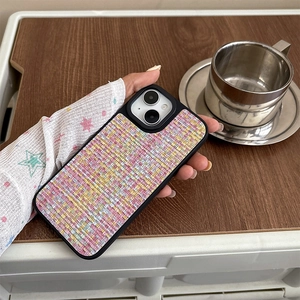 Close-up of pink tweed woven texture phone case for iPhone with slim black frame detail