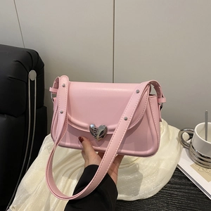 Pink matte leather crossbody bag featuring a silver heart-shaped metal lock and small square shape