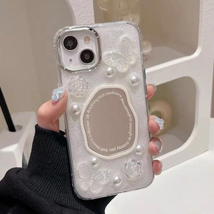 Detail of glitter phone case with 3D butterflies pearls and a small oval mirror