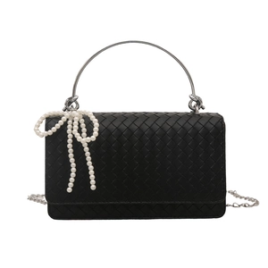 Black woven shoulder bag with pearl bow decoration and silver metal top handle