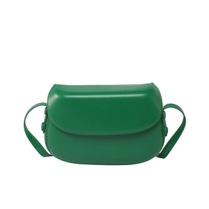 Minimalist bright green crossbody saddle bag with smooth leather finish for women