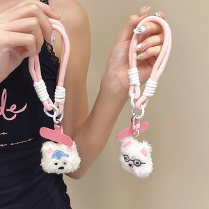 Close-up of plush cat charms with pink braided hand straps and metallic clip fasteners