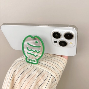 Detail of fish-shaped phone socket mirror with green trim on a white smartphone