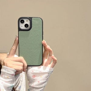 Detail of light green litchi texture leather case for iPhone with protective camera frame