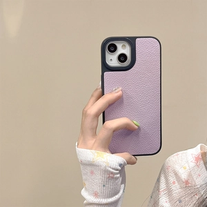 Macro detail of purple lychee grain leather texture on iPhone protective phone case