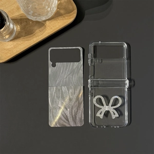 Clear folding phone case with sparkling rhinestone bow and grey marble pattern insert