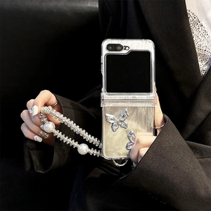 Detail of luxury Z Flip case featuring 3D butterflies, pearl texture and beaded strap