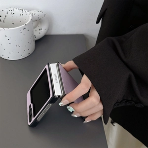Detail view of purple lychee grain leather case for Samsung Z Flip series foldable phone