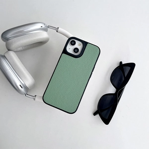 Detail of mint green lychee pattern leather phone case for iPhone with matte black edges