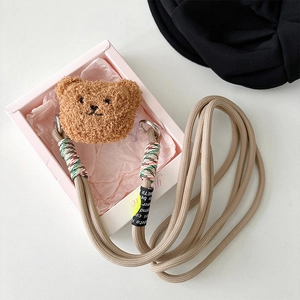 Plush bear phone case strap and woven crossbody lanyard in a clean white gift box