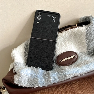 Detailed close-up of premium black lychee pattern leather case for foldable smartphones