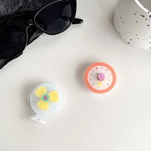 Detail of cute rotatable fan and star pattern collapsible phone socket grips