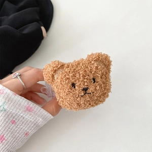 Detailed view of a plush brown teddy bear head strap clip with soft lamb wool texture