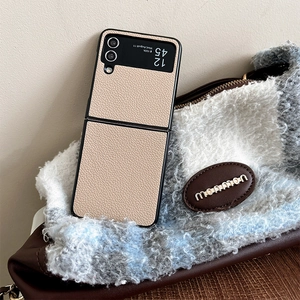 Detail of camel lychee leather texture on a folding case for Samsung Z Flip series