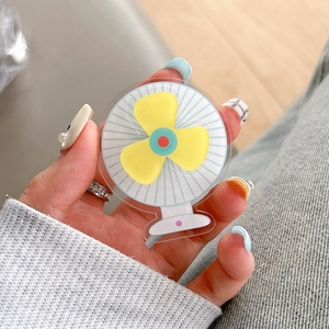 Detail of creative mini fan phone grip made of transparent acrylic material held in hand