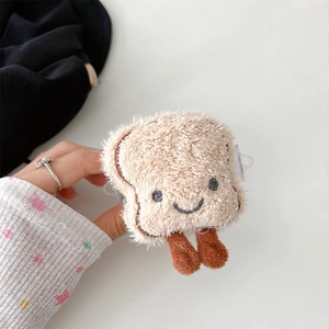 Close-up of plush toast bread headphone case with embroidered smile and soft brown fur