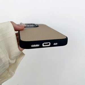 Close-up of khaki litchi leather phone case with precise charging port and speaker cutouts