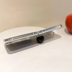 Side view of Galaxy Z Flip5 clear case with black spherical ring grip and wrist strap
