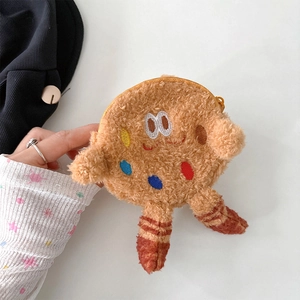 Detail of cartoon plush cookie coin purse with colorful embroidery and gold zipper closure