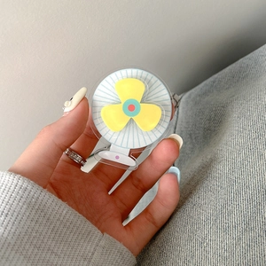 Detailed view of yellow rotating fan shaped phone grip holder made of acrylic material