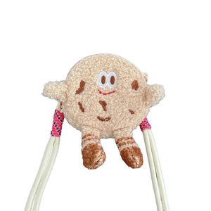 Cute plush cookie cross-body bag with teddy fleece texture and woven shoulder strap