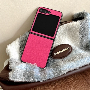 Detail of rose pink lychee leather phone case for Samsung Z Flip series with black edges