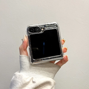 Close-up of glitter sequins texture and ring holder on transparent folding phone case