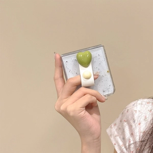 Glittering clear case for Samsung Z Flip 6 with green heart ring and white leather strap