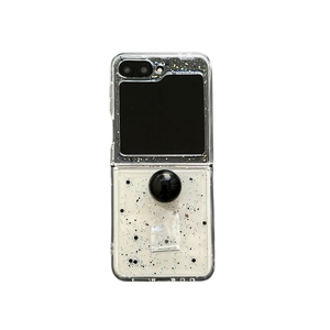 Glitter case for Samsung Z Flip 6 with circular ring holder and black sequin patterns