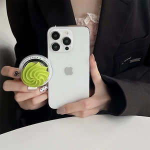 Realistic green cream swirl phone grip socket with Gift For You print on white smartphone