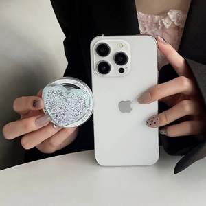 Close-up of heart-shaped magnetic phone grip with blue glitter and Gift For You text