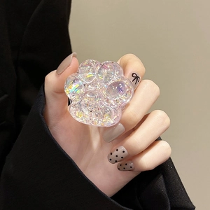 Detailed view of 3D cat paw phone grip with colorful sequins and holographic effect