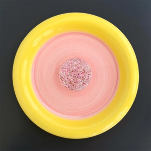 Close-up of heart round expandable phone grip with pink glitter and yellow border