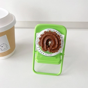 Realistic chocolate cookie phone grip displayed in a Gift For You transparent tray